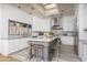 Bright kitchen features a large island, pendant lights, and stainless steel appliances at 8817 N 58Th Pl, Paradise Valley, AZ 85253