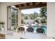 Kitchen with counter seating and a clear view of the pool area and backyard at 8817 N 58Th Pl, Paradise Valley, AZ 85253