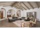 Open living area with wood floors and a large sofa at 8817 N 58Th Pl, Paradise Valley, AZ 85253