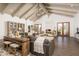 Inviting living room with vaulted ceilings, fireplace, and wood floors create a warm atmosphere at 8817 N 58Th Pl, Paradise Valley, AZ 85253