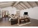 Bright living room featuring vaulted ceilings and a cozy fireplace enhance this living space at 8817 N 58Th Pl, Paradise Valley, AZ 85253