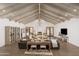 Open living area showcases wood floors, wood beams, fireplace, and abundant natural light at 8817 N 58Th Pl, Paradise Valley, AZ 85253