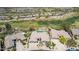 Aerial view of luxury homes with private pools next to a golf course nestled in the desert mountains at 9440 N Sunset Rdg, Fountain Hills, AZ 85268