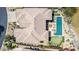 Expansive aerial view of a luxury home featuring a private pool, putting green, and lush desert landscaping at 9440 N Sunset Rdg, Fountain Hills, AZ 85268