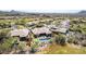 Desert community home with putting green and pool, surrounded by desert vegetation at 9440 N Sunset Rdg, Fountain Hills, AZ 85268