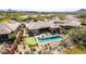 Inviting backyard with pool, putting green, outdoor seating, and built-in grill perfect for entertaining at 9440 N Sunset Rdg, Fountain Hills, AZ 85268