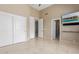 Bedroom featuring a sliding door closet, high ceilings, and tile flooring at 9440 N Sunset Rdg, Fountain Hills, AZ 85268