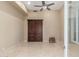 Neutral-colored bedroom with ceiling fan, shuttered windows, and a large built-in wooden cabinet at 9440 N Sunset Rdg, Fountain Hills, AZ 85268