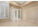 Light filled room with a tiled floor and french doors that lead to another room at 9440 N Sunset Rdg, Fountain Hills, AZ 85268