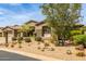 Luxury home featuring desert landscaping and a three-car garage at 9440 N Sunset Rdg, Fountain Hills, AZ 85268