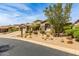 Luxury home featuring desert landscaping and a three-car garage at 9440 N Sunset Rdg, Fountain Hills, AZ 85268