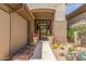 A decorative front door welcomes you to a beautifully landscaped entrance with desert plants at 9440 N Sunset Rdg, Fountain Hills, AZ 85268