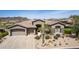 Stunning single-story home featuring a desert landscape, spacious 3-car garage and neutral color palette at 9440 N Sunset Rdg, Fountain Hills, AZ 85268
