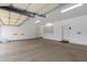 Spacious garage with epoxy floors, neutral paint, and ample lighting for multiple vehicles at 9440 N Sunset Rdg, Fountain Hills, AZ 85268