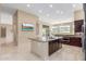 Open kitchen with a granite island, stainless steel appliances, and access to outdoor patio at 9440 N Sunset Rdg, Fountain Hills, AZ 85268