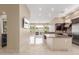 Bright, open kitchen flows into a dining and living space featuring granite countertops and stainless steel appliances at 9440 N Sunset Rdg, Fountain Hills, AZ 85268