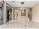 Living room features polished floors, stylish chandelier, and sliding glass doors to outdoor patio at 9440 N Sunset Rdg, Fountain Hills, AZ 85268