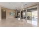 Open living room features polished floors, a modern ceiling fan and sliding glass doors at 9440 N Sunset Rdg, Fountain Hills, AZ 85268