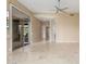 Spacious living area with an open floorplan, tile floors, and access to outdoor seating at 9440 N Sunset Rdg, Fountain Hills, AZ 85268