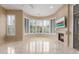 Bright, comfortable living space with fireplace, large windows and recessed lighting at 9440 N Sunset Rdg, Fountain Hills, AZ 85268