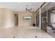 Light and bright living room with polished floors and large sliding glass doors to outdoor patio at 9440 N Sunset Rdg, Fountain Hills, AZ 85268
