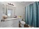 A clean bathroom features a shower and bath, a modern vanity and decorative accents at 10807 W Northern Ave # 113, Glendale, AZ 85307