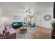 Comfortable living room featuring a ceiling fan, bright accents, and tile flooring at 10807 W Northern Ave # 113, Glendale, AZ 85307