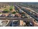 An aerial view shows the property's location near a golf course and its position in a community at 10843 E Kilarea Ave, Mesa, AZ 85209