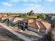 Aerial shot of a well-maintained home with desert landscaping in a quiet residential neighborhood at 10843 E Kilarea Ave, Mesa, AZ 85209