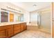 Bright bathroom featuring a double vanity, soaking tub and walk-in shower at 10843 E Kilarea Ave, Mesa, AZ 85209