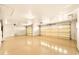 Spacious three car garage with finished floors and ample lighting at 10843 E Kilarea Ave, Mesa, AZ 85209