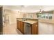 Kitchen with a functional island, stainless steel appliances and plenty of natural light at 10843 E Kilarea Ave, Mesa, AZ 85209