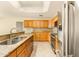 Bright kitchen featuring stainless steel appliances and granite countertops at 10843 E Kilarea Ave, Mesa, AZ 85209