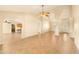 Bright open-concept living area with tile floors, high ceilings, and abundant natural light at 10843 E Kilarea Ave, Mesa, AZ 85209