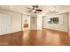 Spacious main bedroom with tray ceiling and wood floors at 10843 E Kilarea Ave, Mesa, AZ 85209
