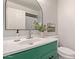 Stylish bathroom with a modern vanity, elegant mirror, and fresh greenery at 1311 W Palo Verde Dr, Chandler, AZ 85224