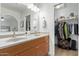 Modern bath with double sinks and mirrors, walk-in closet and neutral decor at 1311 W Palo Verde Dr, Chandler, AZ 85224