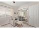 Bright bedroom with a mirrored closet, comfortable recliner, and neutral decor at 1311 W Palo Verde Dr, Chandler, AZ 85224