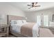 Large bedroom with neutral decor and access to backyard pool area at 1311 W Palo Verde Dr, Chandler, AZ 85224