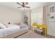Comfortable bedroom featuring a bed, desk, and ample natural light at 1311 W Palo Verde Dr, Chandler, AZ 85224