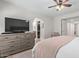 Bedroom with large TV, walk-in closet, and ensuite bathroom at 1311 W Palo Verde Dr, Chandler, AZ 85224