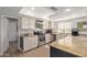 Bright kitchen features granite countertops, stainless steel appliances, and wooden cabinets at 1311 W Palo Verde Dr, Chandler, AZ 85224