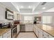 Bright kitchen features granite countertops, stainless steel appliances, and wooden cabinets at 1311 W Palo Verde Dr, Chandler, AZ 85224