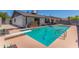 Beautiful backyard pool, diving board and covered patio perfect for outdoor fun and relaxation at 1311 W Palo Verde Dr, Chandler, AZ 85224
