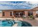 A relaxing backyard showcasing an inviting pool and covered patio, perfect for outdoor living at 13146 S 178Th Ave, Goodyear, AZ 85338