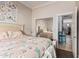 Bright bedroom boasts a mirrored closet, a view into an adjacent room, and cozy decor at 13146 S 178Th Ave, Goodyear, AZ 85338