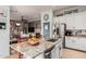 Open kitchen with a large island, stainless steel fridge, and seamless flow to the living area at 13146 S 178Th Ave, Goodyear, AZ 85338