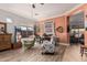 Cozy living area with stylish seating, warm colors, and ample natural light from large windows at 13146 S 178Th Ave, Goodyear, AZ 85338