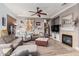 Comfortable living room featuring a fireplace, cozy seating, and a relaxing atmosphere at 13146 S 178Th Ave, Goodyear, AZ 85338