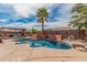 Inviting backyard oasis featuring a sparkling pool with surrounding patio and covered area for outdoor enjoyment at 13146 S 178Th Ave, Goodyear, AZ 85338